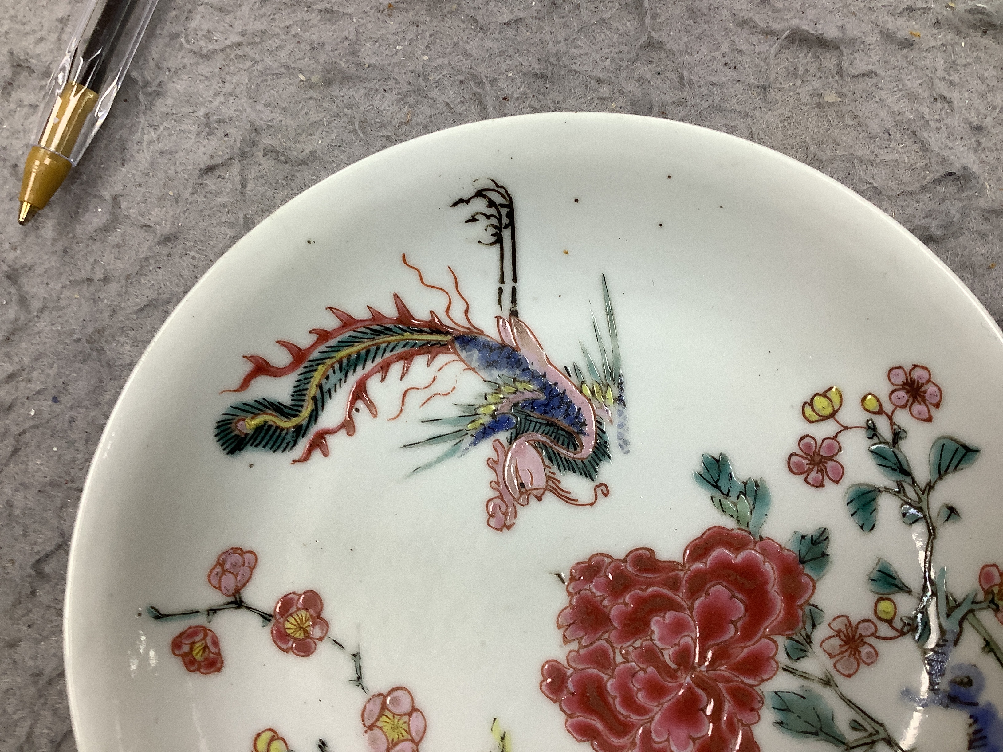 A Chinese famille rose fencai ‘phoenix and peony’ saucer dish, Yongzheng period, 10cm